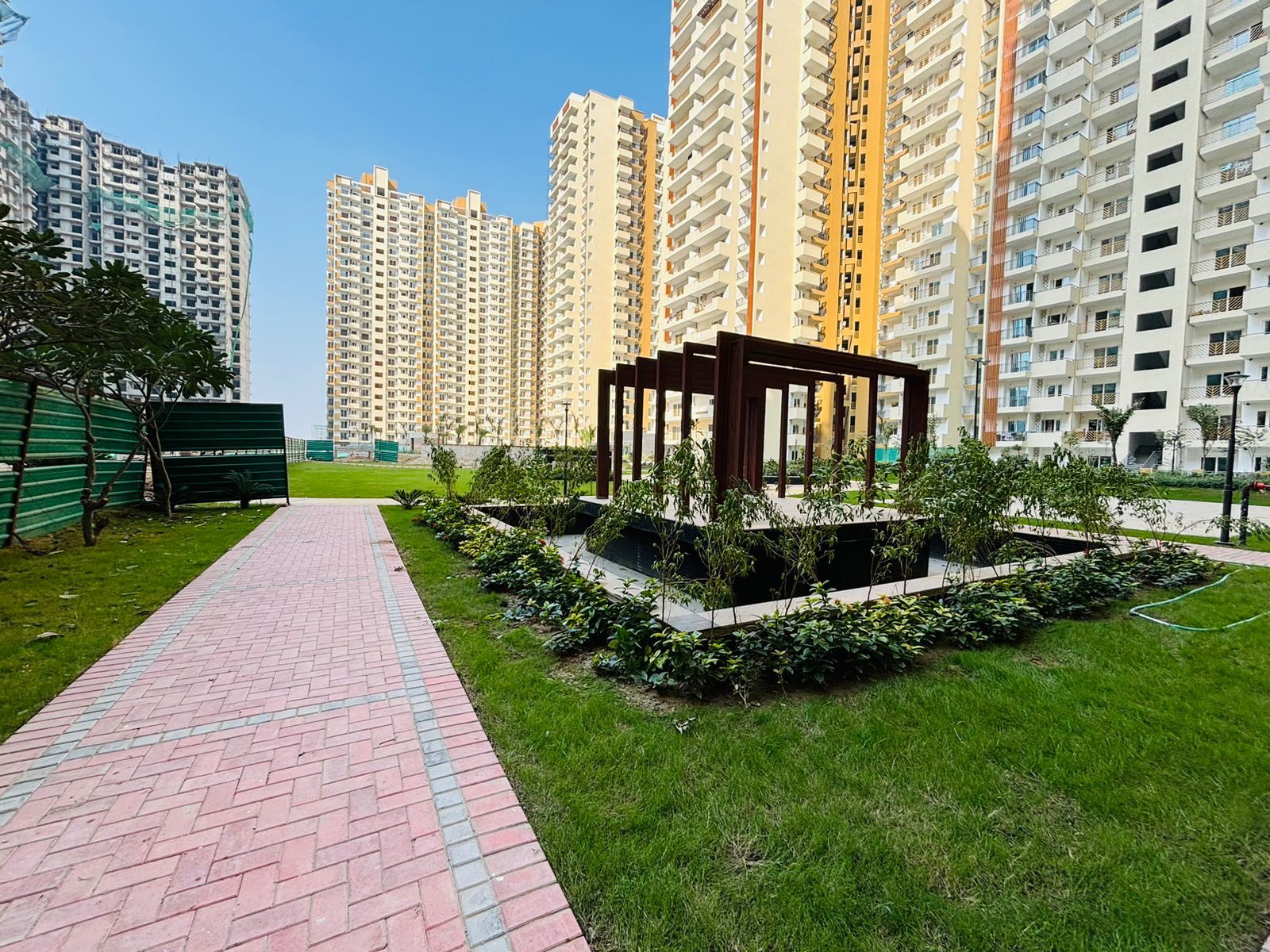 Nirala Estate towers and landscaped green area in Greater Noida West